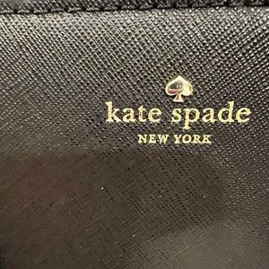 This on the large size handbag holds a lot and there is a zipper for safety